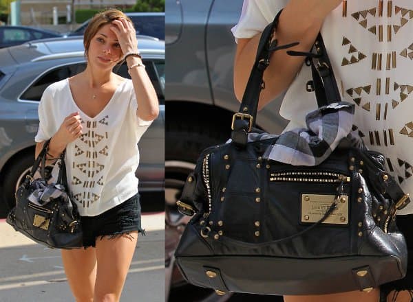 Ashley Greene complements her edgy daytime style with the iconic Louis Vuitton 'Rivets' handbag, making a bold fashion statement