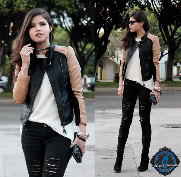 Adriana showcases a chic office look with black distressed jeans and a two-tone biker jacket, elevated with gold jewelry and suede heels