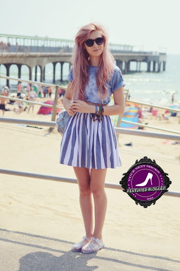 Amy brings effortless summer vibes with her tie-dye cropped tee, striped high-waist skirt, statement bracelets, and clear jelly sandals for a fresh beachside look