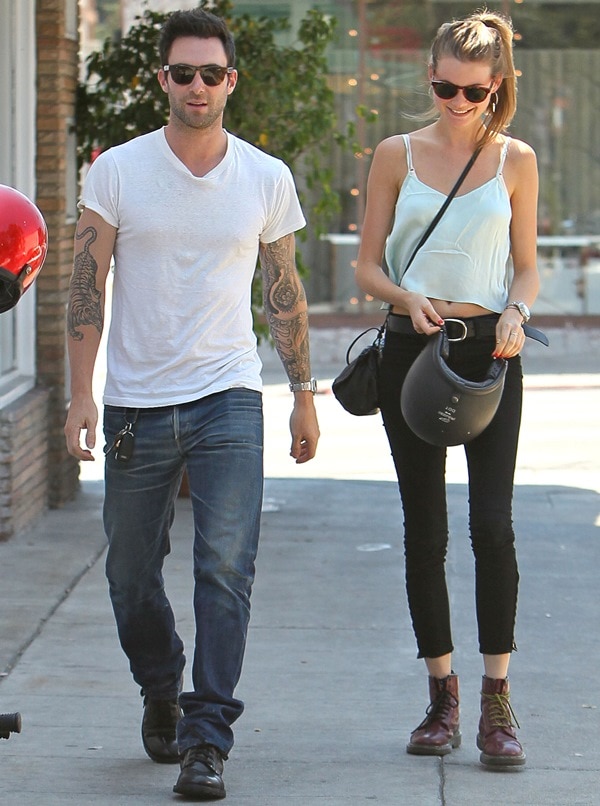 Adam Levine and Behati Prinsloo keep it casual as Behati pairs black skinny jeans with burgundy lace-up combat boots while returning to their parked motorcycle after lunch at Mustard Seed Cafe in Los Feliz on August 7, 2012