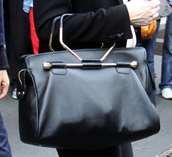 Cate Blanchett carries a black Viktor  Rolf Bombette bag in Milan