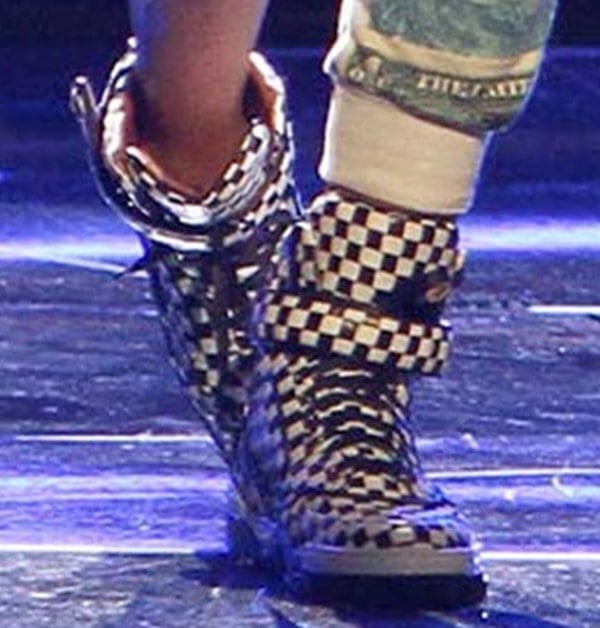 Ciara hits the stage in bold black-and-white Givenchy high-top sneakers, the basket-woven leather and gold-tone hardware adding graphic edge and performance-ready attitude to her look