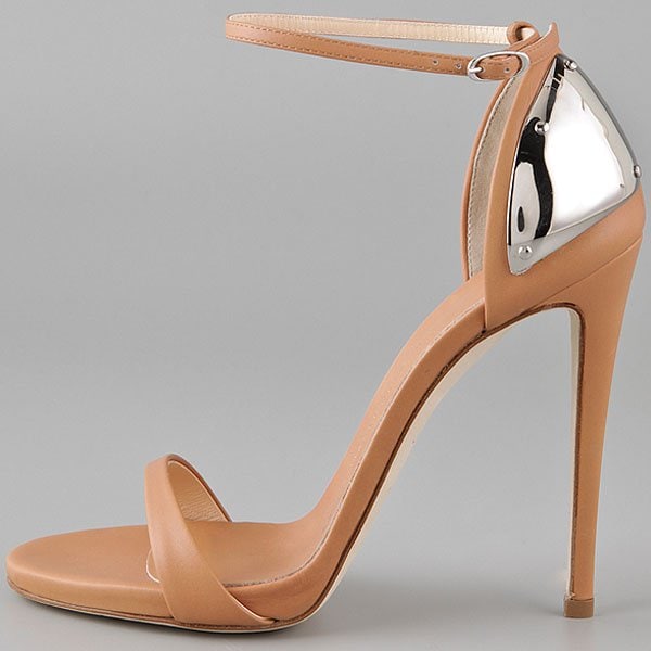 Giuseppe Zanotti’s nude plated-heel sandals, featuring a sculptural metallic heel counter and sleek ankle strap