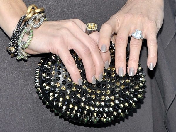 Edgy Elegance: Kate Hudson showcases her studded Christian Louboutin 'Mina' clutch at the Novak Djokovic Foundation event, London