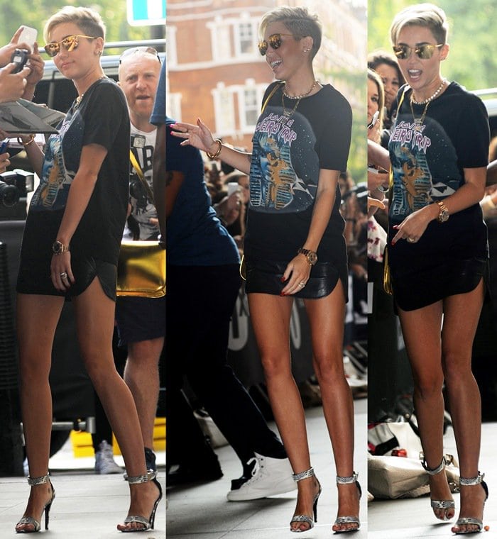 Miley Cyrus in a graphic tee paired with an itty-bitty leather miniskirt