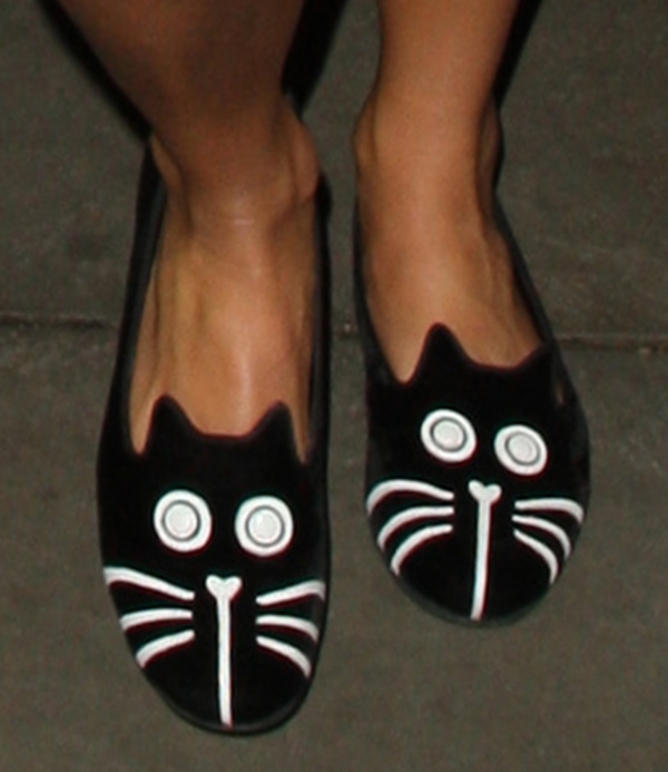 The Marc by Marc Jacobs cat-face slippers are a playful and iconic piece from the now-discontinued line, known for its whimsical, animal-inspired designs, making these velvet flats a rare and collectible fashion find