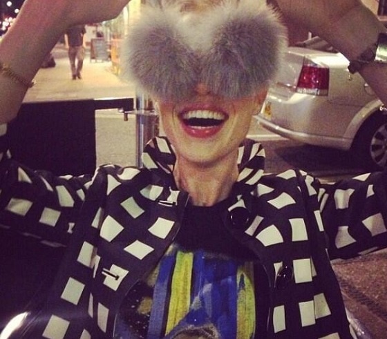 Angela Scanlon goofing around with the detachable pompom detail of her shoes