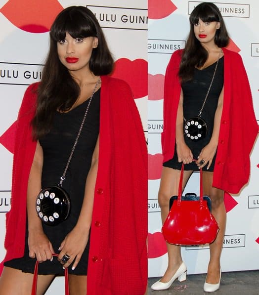 Jameela Jamil pairs a little black dress and white block heels with Lulu Guinness’s bold accessories — the red patent 'Mid Pollyanna' handbag and playful 'Dial M for Murder Fiona' rotary phone clutch — making a head-turning statement at the 2013 Paint Project party