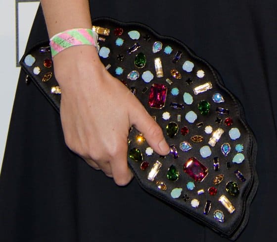A detailed look at Jasmine Guinness's jeweled Lulu Guinness 'Paloma Fan' clutch, embellished with colorful crystals for a whimsical, statement-making finish
