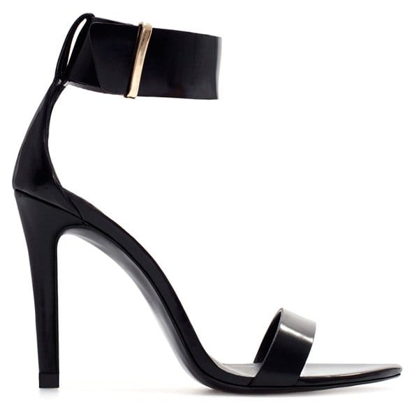 Zara’s black ankle-strap sandals pair a sleek single-sole silhouette with a high stiletto heel and wide cuff strap, delivering a clean, leg-lengthening finish at an accessible $50 price point