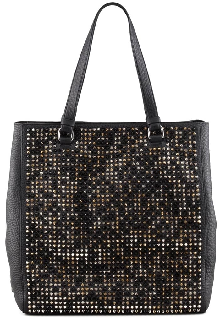 Olivia Wilde's choice of accessory, a spike-loaded Christian Louboutin tote, blends high fashion with a daring edge, making a protective yet posh statement