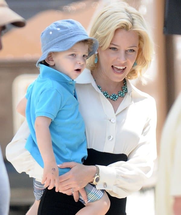 Elizabeth Banks shares a moment with her son Felix on the set of 'Love Mercy' in West Hollywood, highlighting the blend of her professional and personal life on August 18, 2013