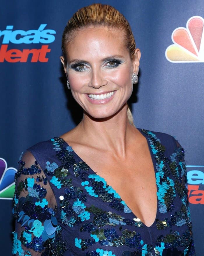 Heidi Klum pushed her blonde hair back into a sleek ponytail