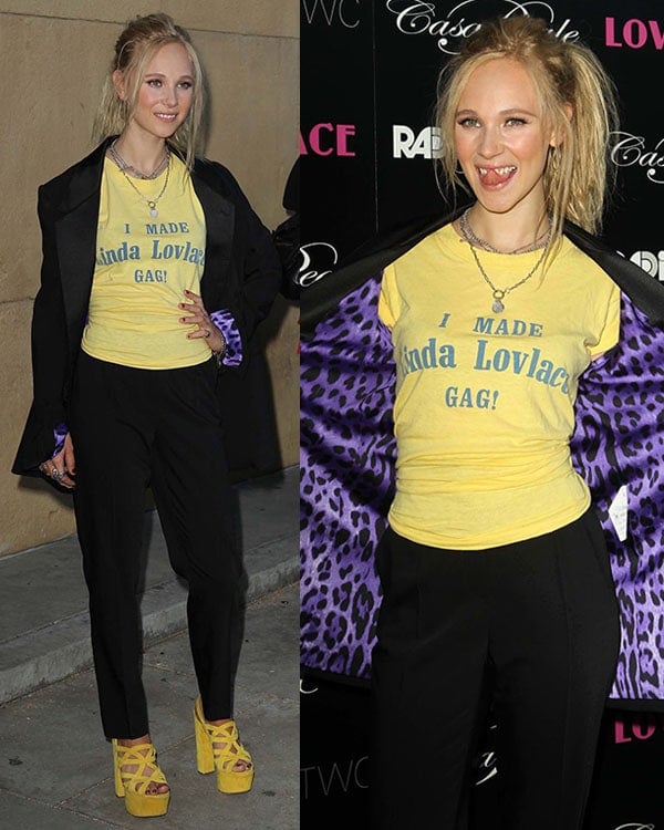 Juno Temple turned heads at the Los Angeles premiere of Lovelace on August 5, 2013, rocking a bold yellow statement tee reading “I MADE Linda Lovelace GAG!” paired with high-waisted trousers, a leopard-lined blazer, and chunky yellow Prada platform heels