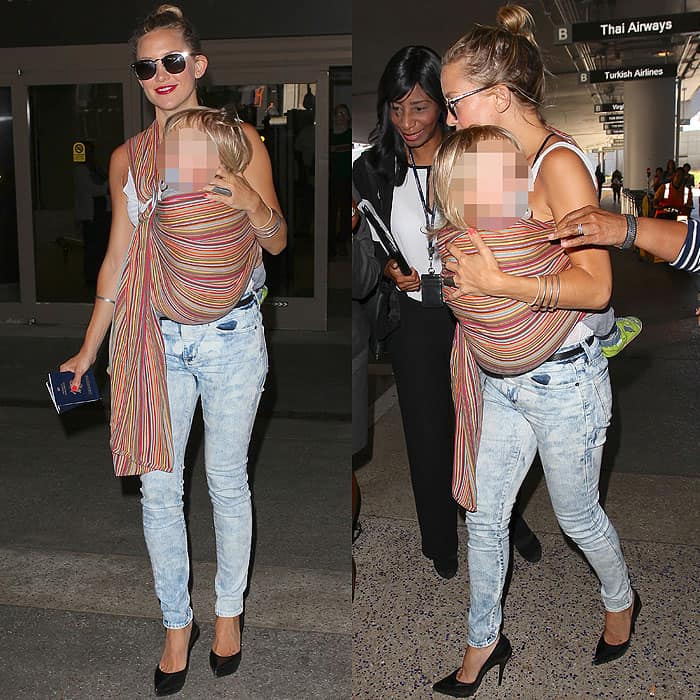 Kate Hudson stylishly totes son Bingham Hawn Bellamy upon their arrival at LAX in Los Angeles, California, captured on July 30, 2013