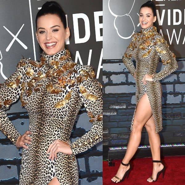 Katy Perry turns heads in a thigh-high Emanuel Ungaro leopard-print dress adorned with gold butterflies, paired flawlessly with sleek black ankle-strap heels
