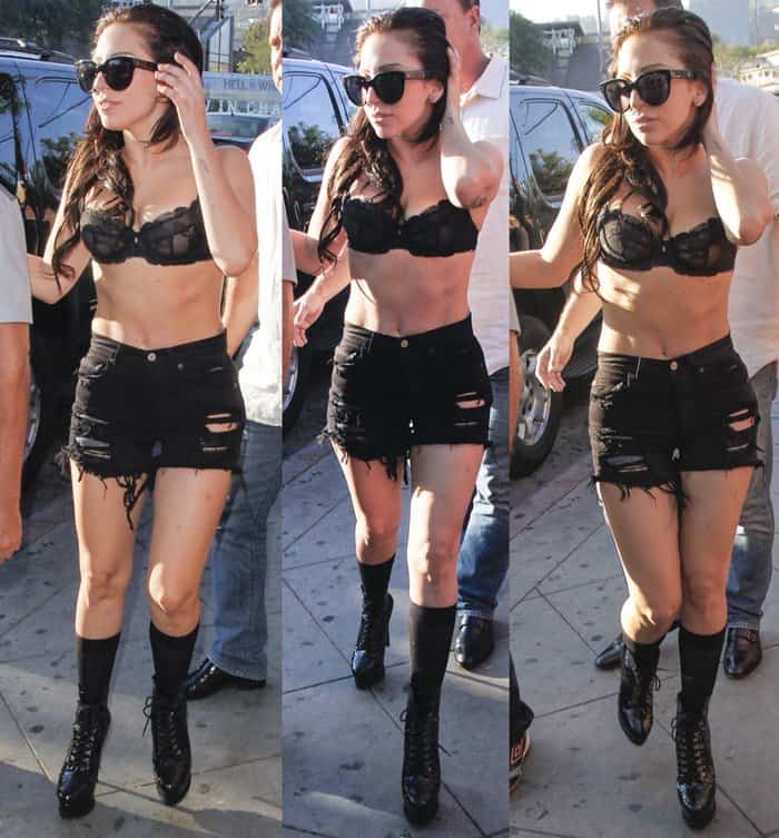 Lady Gaga turns heads in black ripped cutoff shorts, a sheer lace bra, and towering platform lace-up boots while arriving at The Abbey in West Hollywood on August 12, 2013—fully embracing her signature edgy-glam style
