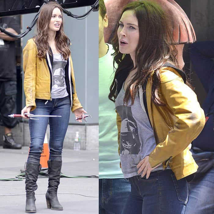 Megan Fox channels April O’Neil in a mustard yellow leather jacket, dark skinny jeans, and heeled black boots, balancing utilitarian ease with a sleek, leg-lengthening silhouette on the New York set of Teenage Mutant Ninja Turtles