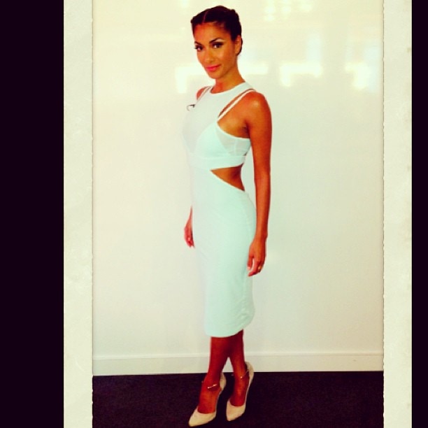 Nicole Scherzinger stuns in a cutout Bec Bridge dress paired with Paperchain jewelry and Richard Braqo’s gold-detailed pumps, as shared on Instagram on August 10, 2013
