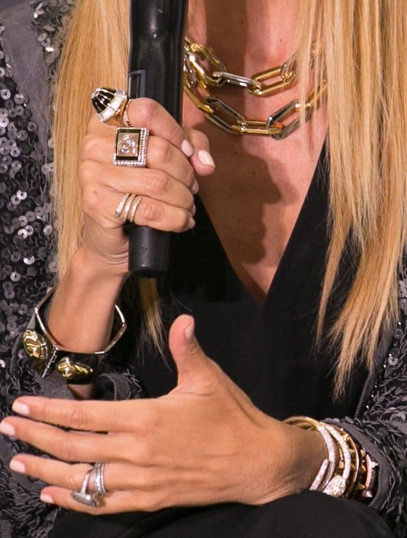 Rachel Zoe elegantly adorned in chunky cuffs, gold chains, and sparkly art deco rings at her Bloomingdale's presentation
