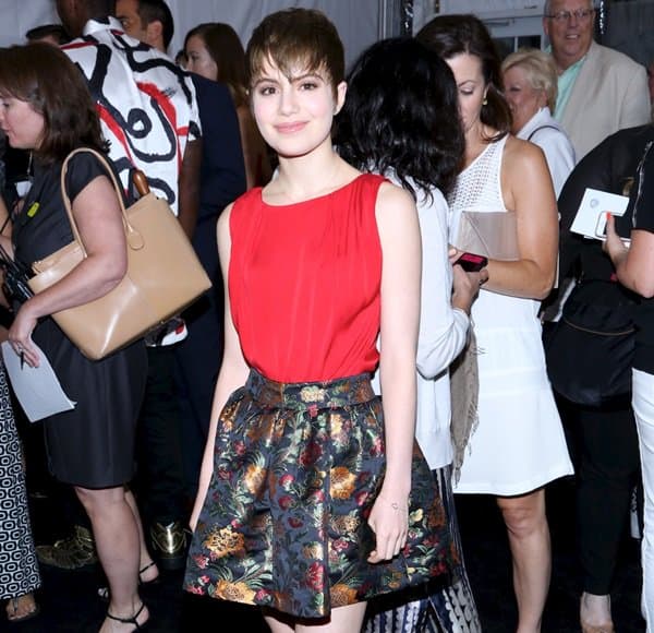 Sami Gayle in a Floral Skirt Sami Gayle at the world premiere of 'We're the Millers' in New York City, elegantly sporting an Alice + Olivia floral skirt paired with a vibrant red top