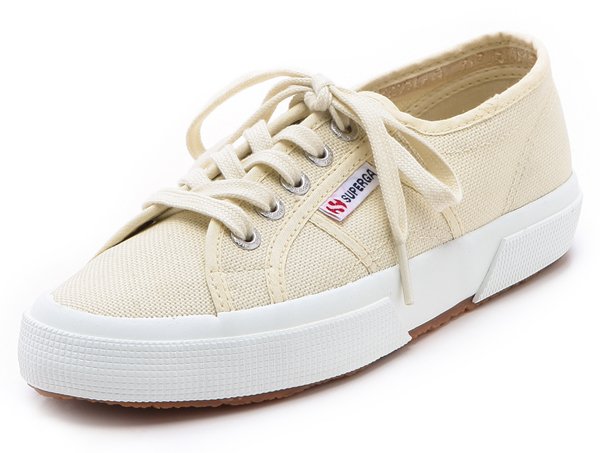 These canvas sneakers feature a logo tag at the lace-up closure.