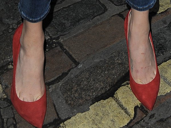 Amanda Seyfried's red suede Brian Atwood Cassandra pumps feature a sharply pointed toe and low-cut vamp that create the silhouette's signature elegance