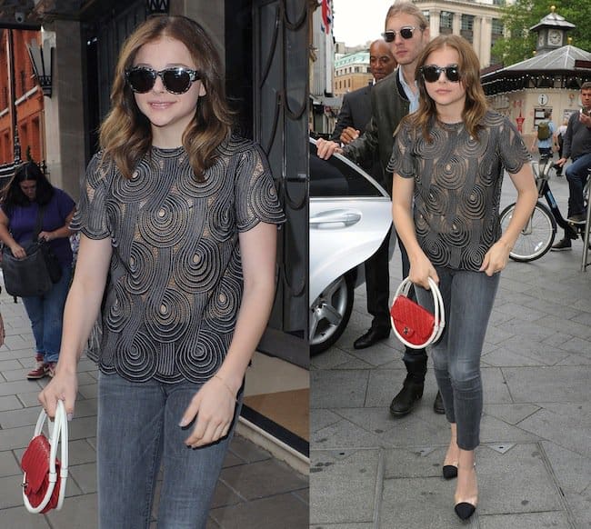 On August 5, 2013, in London, Chloë Grace Moretz was seen stylishly wearing pieces from Christian Dior, Chanel, Christopher Kane, and Repossi, including cat's-eye sunglasses, ankle-strap pumps, crystal-buttoned skinny jeans, a lace T-shirt, a mini hula hoop bag, and a Berbere ring