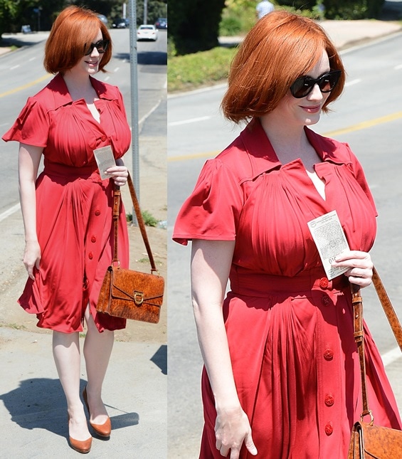 Christina Hendricks steps out in a red belted day dress styled with classic brown Rupert Sanderson pumps at a private Brentwood event
