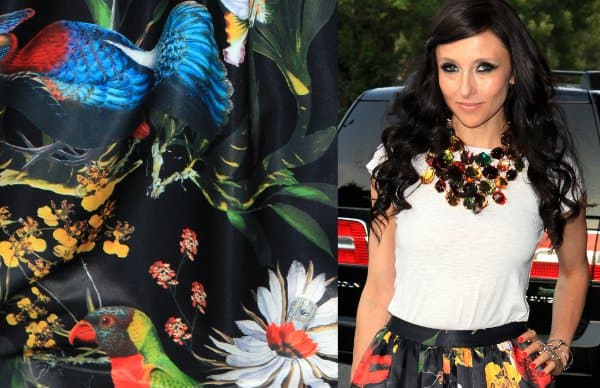 Stacey Bendet's exquisite bib necklace complements the vibrant jewel tones of her floral maxi skirt
