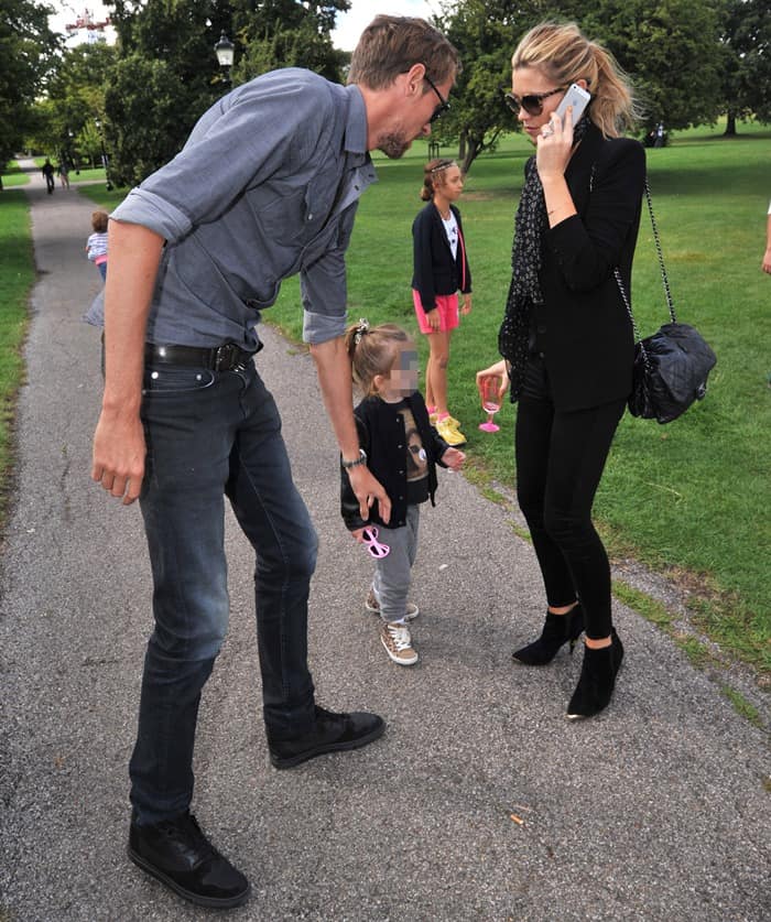 Family Day Out: Peter Crouch and Abigail Clancy, with daughter Sophia, enjoy a stylish outing at Pup Aid 2013, London