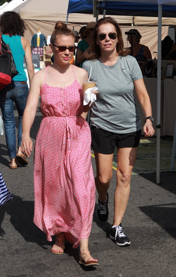 Alyssa Milano looks radiant in a Juicy Couture Starflower Medallion maxi dress during a family outing for her son Milo’s second birthday