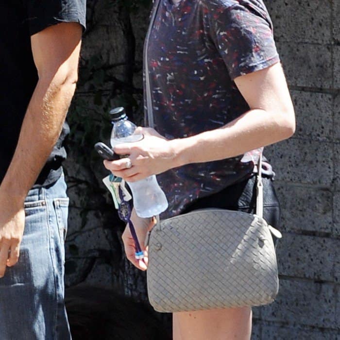 Amanda Seyfried carries a chic Bottega Veneta crossbody bag while on a date with Justin Long