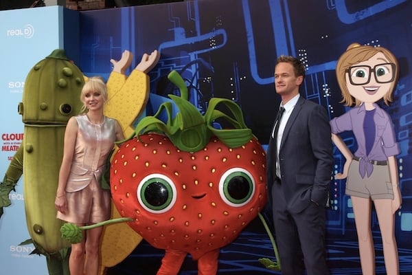 'Cloudy with a Chance of Meatballs 2' voice actors Anna Faris and Neil Patrick Harris posing with cartoon cutouts and mascots