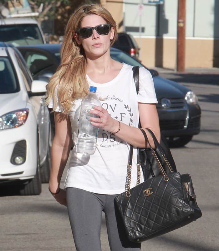 Ashley Greene pairs her workout gear with a luxurious Chanel 'CC Crown' tote in LA