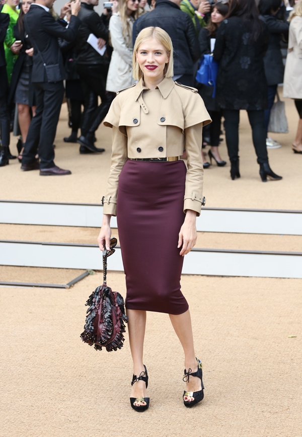 Elena Perminova commands attention in a structured cropped trench coat and sleek maroon pencil skirt, elevated by peep-toe platform heels with bow accents and a textured handbag