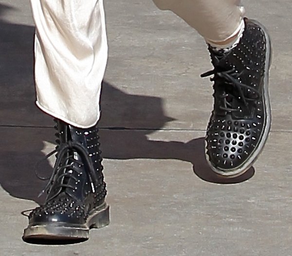 Gwen Stefani's studded Dr. Martens boots transform a casual museum-day outfit into a look that reflects the punk-inspired edge that has long defined her personal style