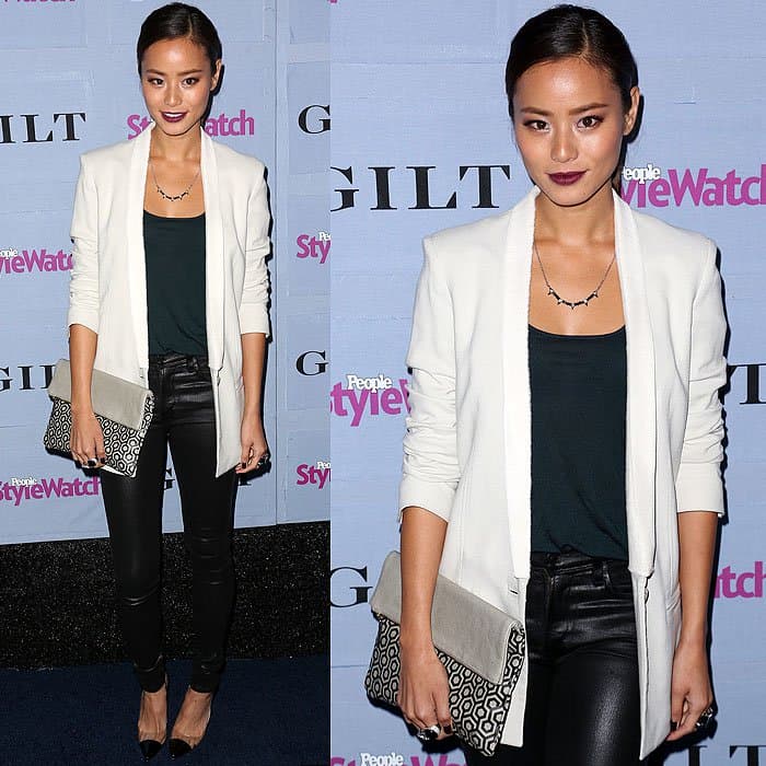 Jamie Chung stuns at the People StyleWatch Denim Party in Citizens of Humanity Black Rocket High Rise Skinny Jeans in Coated Leatherette Denim, a crisp white blazer, and Manolo Blahnik Pacha Clear PVC-Patent Pumps, accessorized with a statement clutch