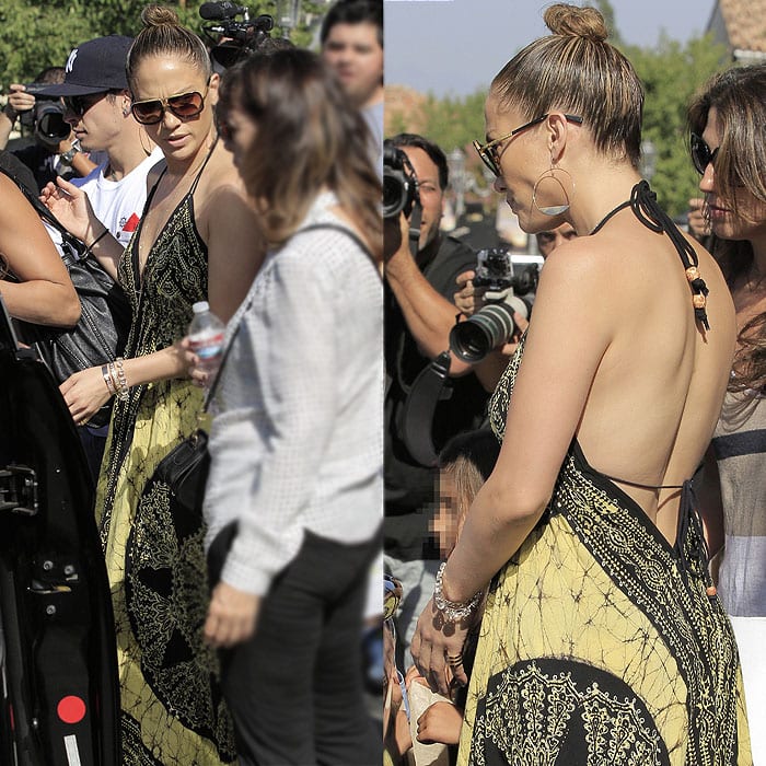 On September 14, 2013, Jennifer Lopez was spotted at Barnes Noble wearing Dita Mach One sunglasses, Lana Jewelry Large Eclipse earrings, and Jean-Michel Cazabat Fela Elastic Strap wedge espadrilles in black