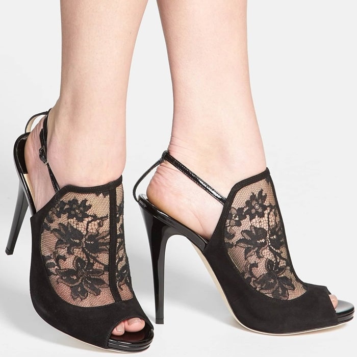 Decadent suede frames the ladylike lace of an impeccably cut sandal perched atop a slim, wrapped heel