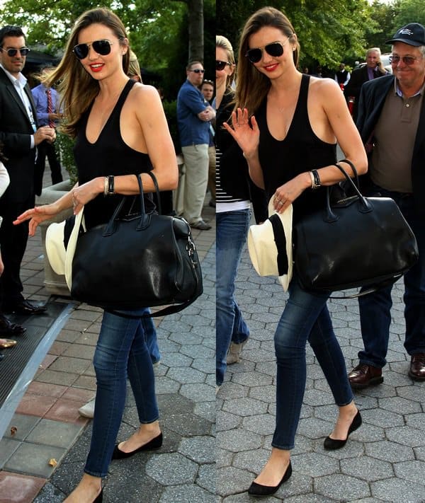 Miranda Kerr attended the U.S. Open Women’s Final on September 8, 2013, styled in a chic ensemble featuring Frame Denim skinny jeans, a T by Alexander Wang tank, Givenchy zipper ballet flats and Antigona duffle, accessorized with a Longines watch, Mcs Elena bracelet, and Oliver Peoples aviators