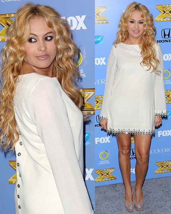 Paulina Rubio poses at The X Factor Season 3 premiere party on September 5, 2013, wearing an embellished white long-sleeved dress and sparkling Charlotte Olympia "Paparazzi" pumps