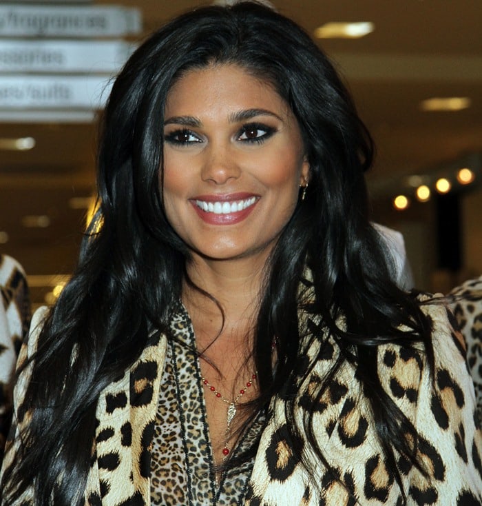 Rachel Roy pairs her voluminous, glossy waves with a bold leopard-print outfit