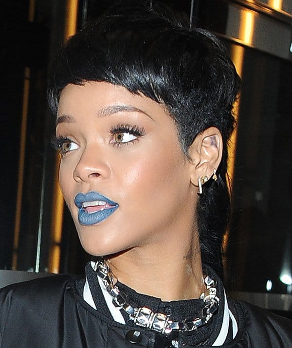Close-up of Rihanna's striking pale blue-gray lips, adding a pop of color to her edgy look