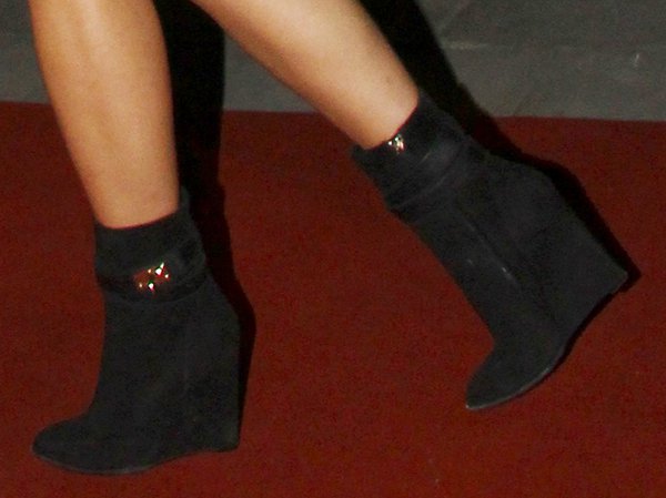 Rita Ora wearing black ankle wedge booties by Givenchy
