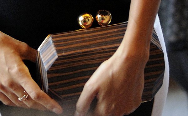 Thandiwe Newton adds a touch of elegance with her Stella McCartney gold-accented clutch at the 2013 Toronto International Film Festival