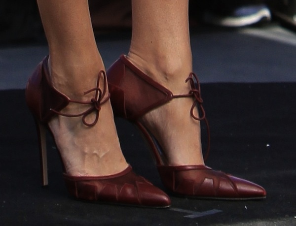Close-up of Eva Mendes’ burgundy Bionda Castana “Lana” pumps highlights the signature pointed toe, paneled leather construction, and delicate tie-front detail