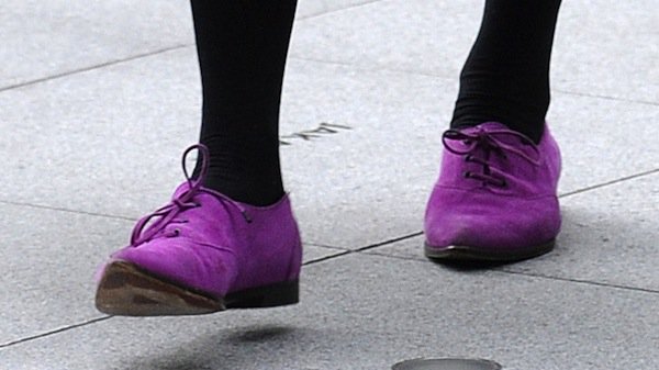 Fearne Cotton injects color into her BBC Radio 1 commute with purple lace-up shoes, using an unexpected hue to sharpen an otherwise understated daytime outfit