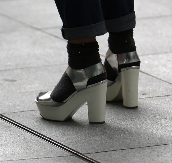 Fearne Cotton grounds her BBC Radio 1 street style with silver platform sandals worn over black socks, using bold footwear to turn an everyday commute into a deliberate fashion statement