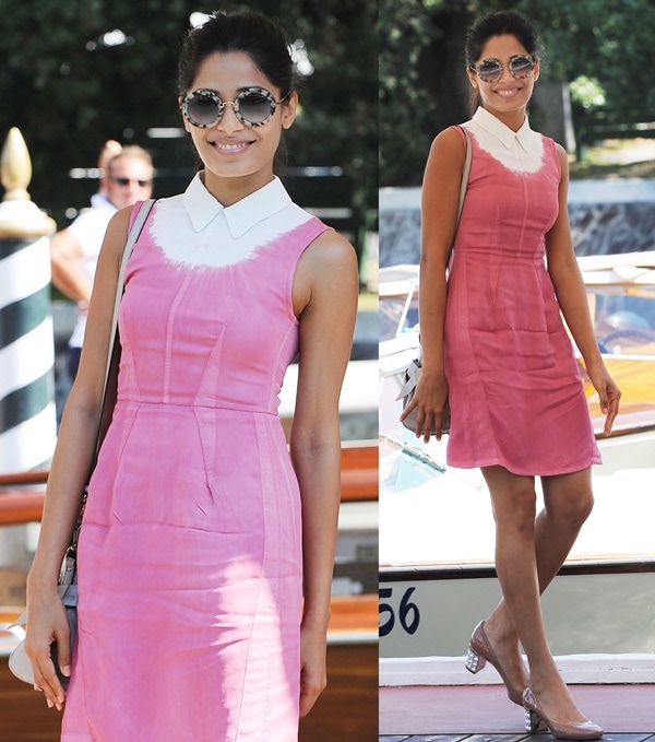 Freida Pinto wears a pink-and-white sundress with Miu Miu accessories and nude pumps in Venice